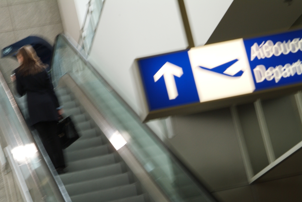 Woman on The Escalator in Airport