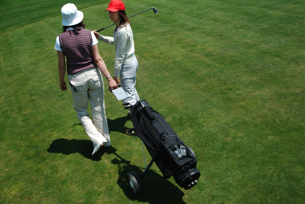 Female Golfers Walking to The Next Hole